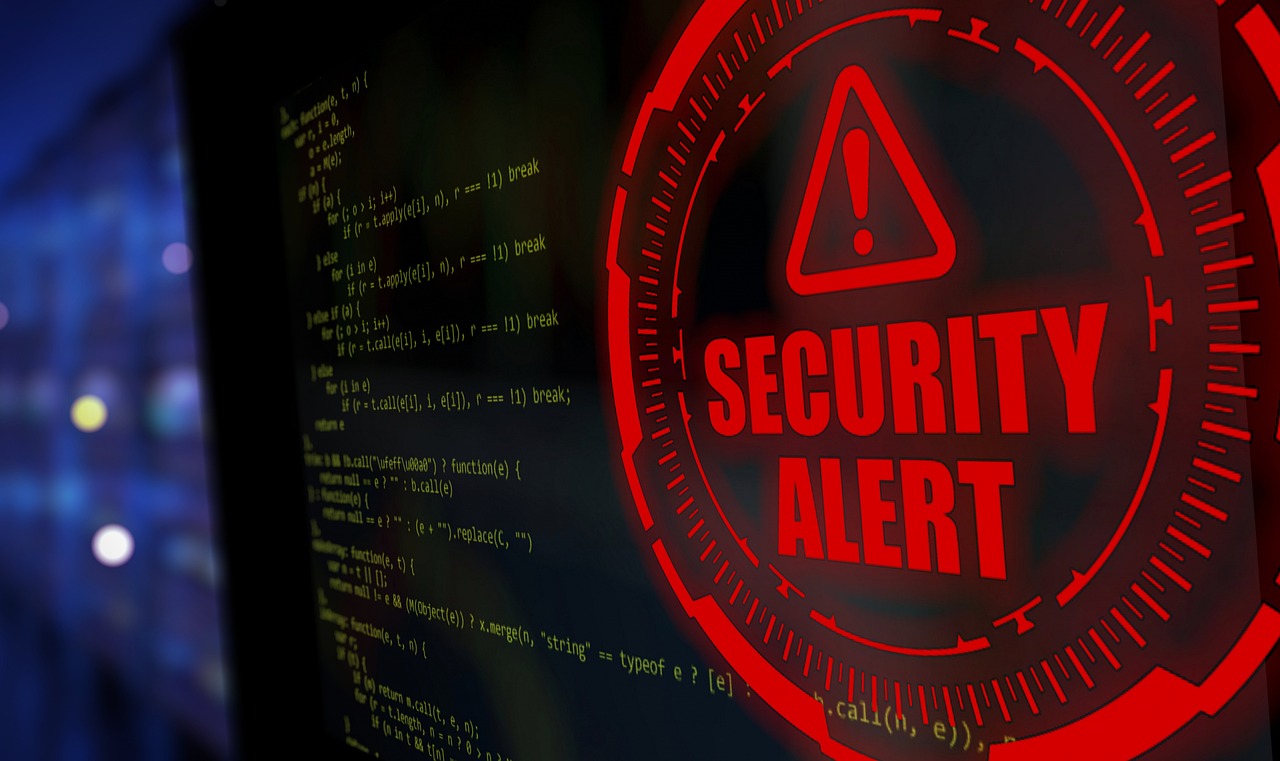 赤い「SECURITY ALERT」の警告表示が画面に浮かび上がるイメージ